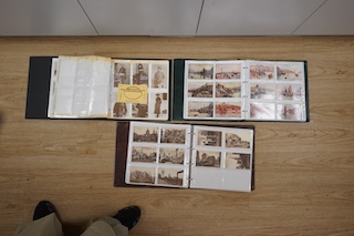 Three postcard albums containing a collection of Edwardian and later postcards, including some London scenes, London zoo, as well as other topographical scenes from Leigh-on-Sea, Whitby, Canterbury, Clacton, etc., plus s